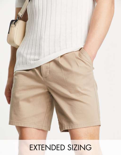 ASOS DESIGN pleated shorts in mid length in beige