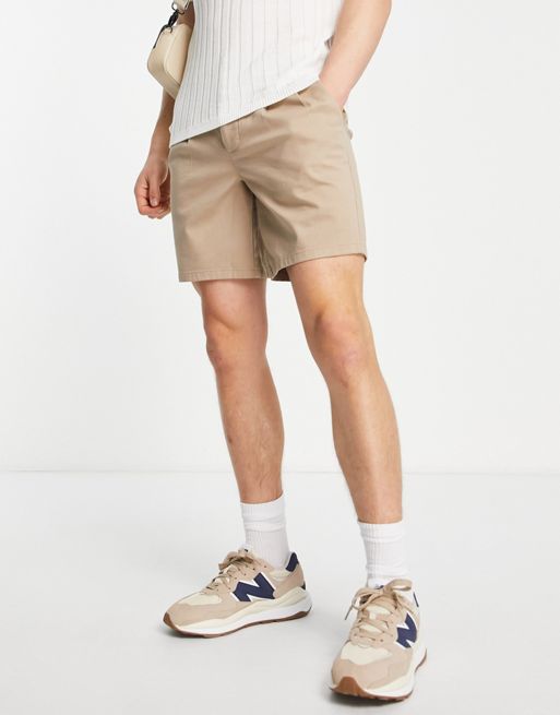ASOS DESIGN pleated shorts in mid length in beige