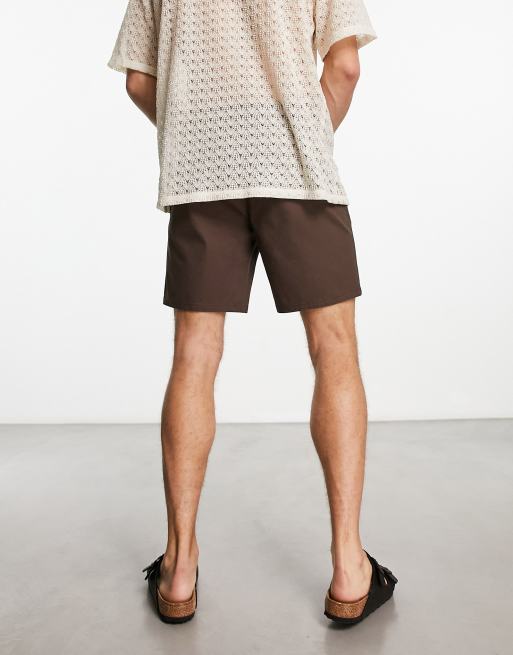 ASOS DESIGN pleated shorts in mid length in beige