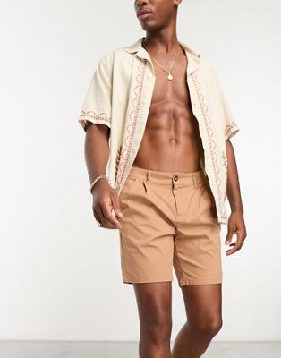 ASOS DESIGN pleated shorts in mid length in tan  - ASOS Price Checker