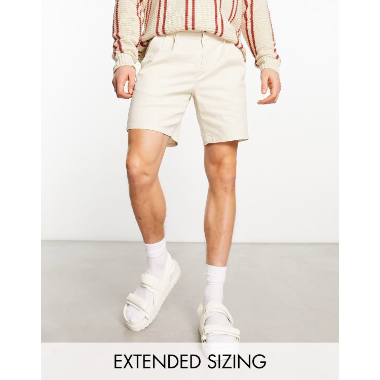 ASOS DESIGN pleated shorts in mid length in tan