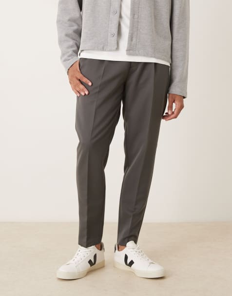 ASOS DESIGN pleated tapered dress pants in charcoal - view 1