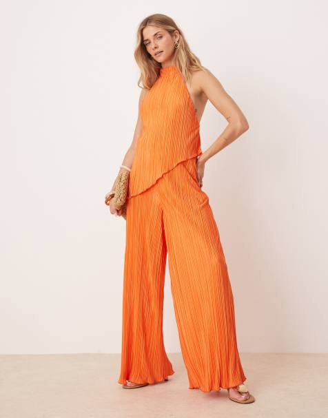 ASOS DESIGN plisse halter neck wide leg jumpsuit in orange - view 1