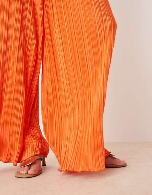 ASOS DESIGN plisse halter neck wide leg jumpsuit in orange