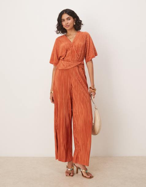 ASOS DESIGN plisse plunge short sleeve wrap waist jumpsuit in rust - view 1