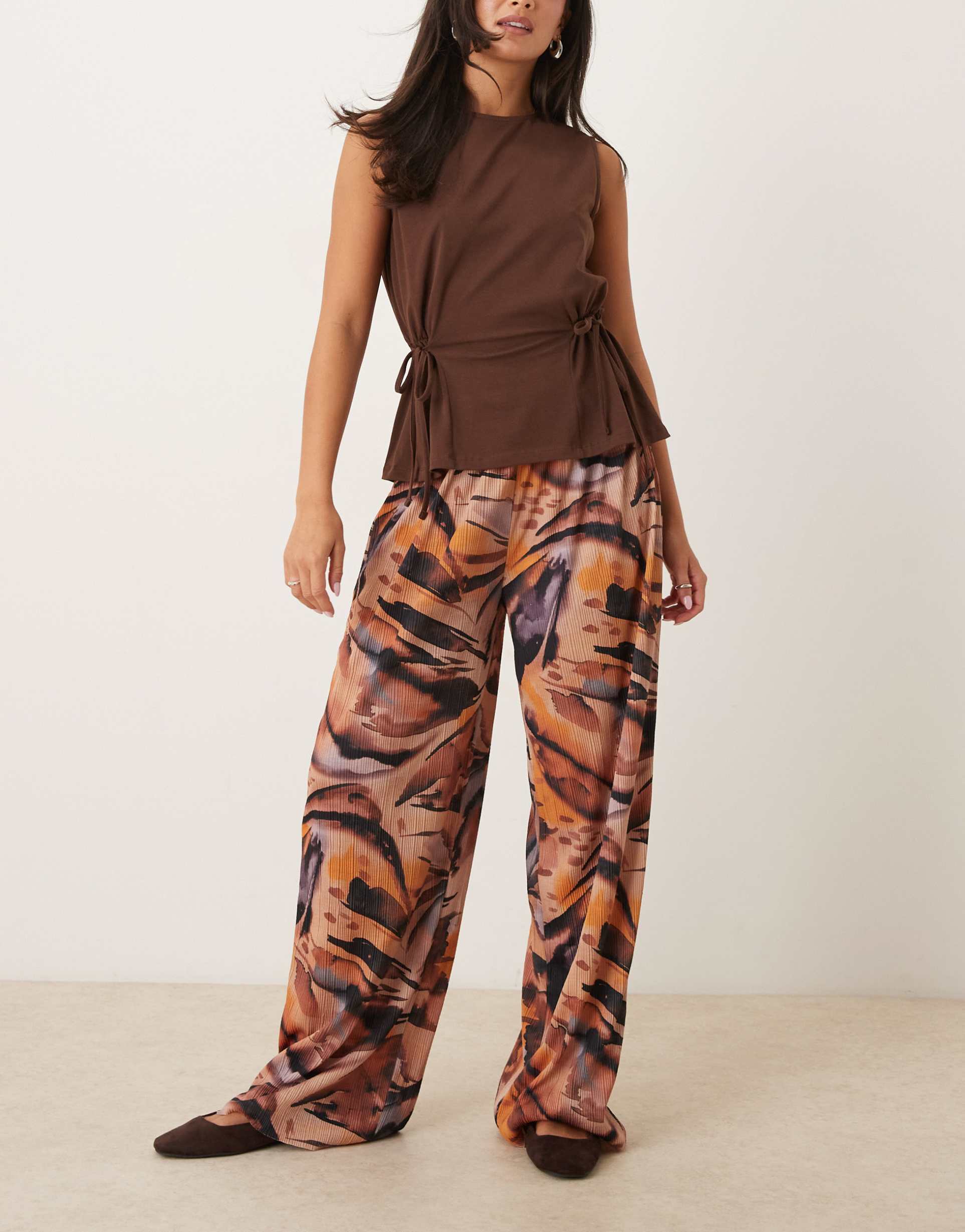 ASOS DESIGN plisse wide leg trousers in orange marble print