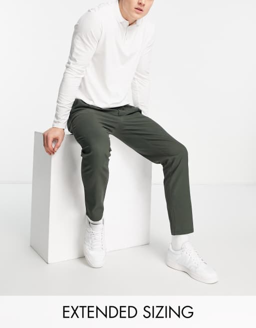 ASOS DESIGN – Plissierte, dunkelgrüne Chinohose in Karottenform