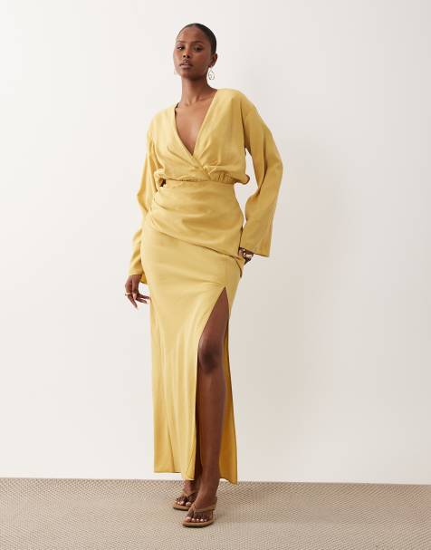 ASOS DESIGN plunge maxi dress with wide cuffs and side split in burnished gold