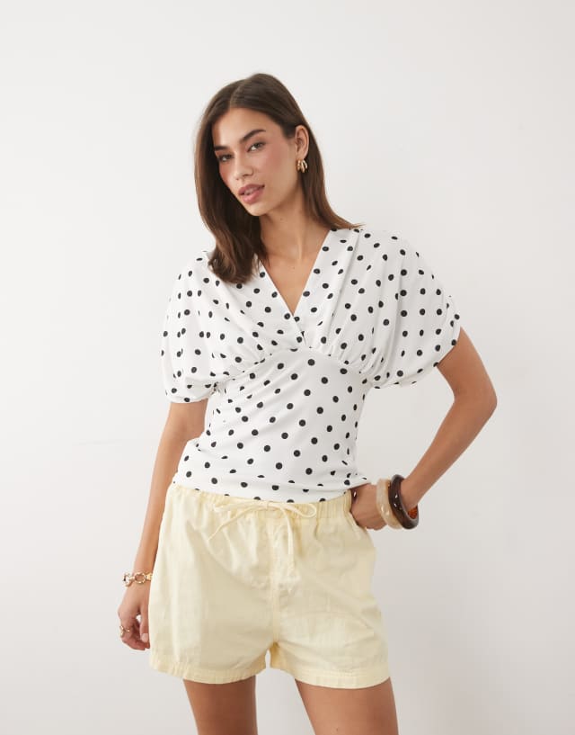 ASOS DESIGN plunge with cinched waist top in stone polka dot
