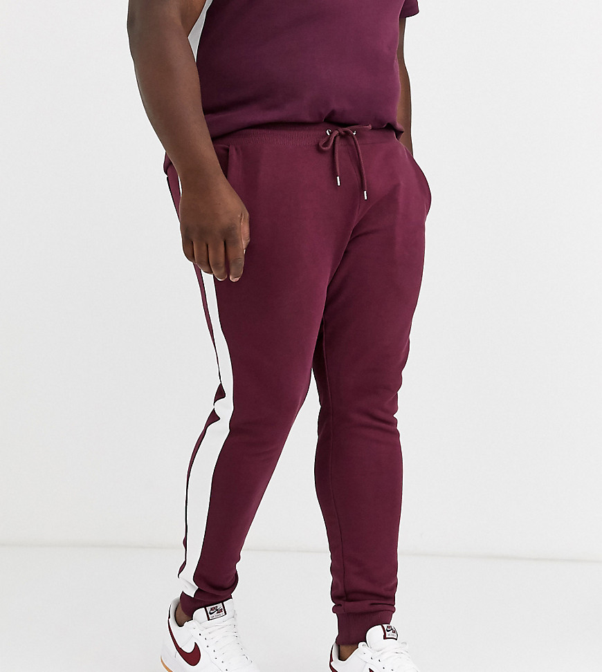 ASOS DESIGN Plus co-ord skinny joggers with side stripe in burgundy-Red