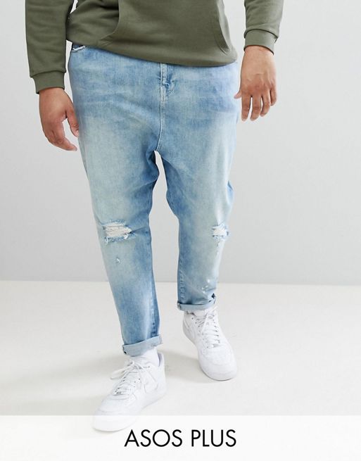 ASOS DESIGN Plus Drop Crotch Jeans In Mid Wash Blue With Rips | ASOS