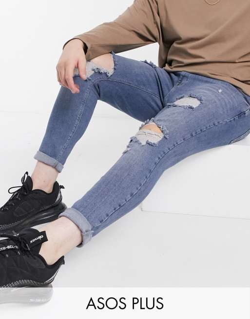 ASOS DESIGN Plus - Jean seconde peau aspect vintage avec denim power stretch et larges déchirures - Bleu moyen