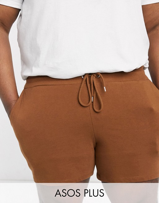 ASOS DESIGN Plus jersey slim shorts in shorter length in brown