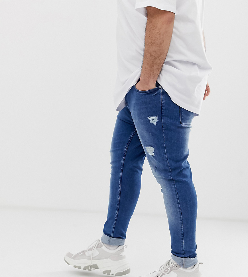 ASOS DESIGN – Plus – Mellanblå jeans med spray on-passform, power stretch och slitna partier