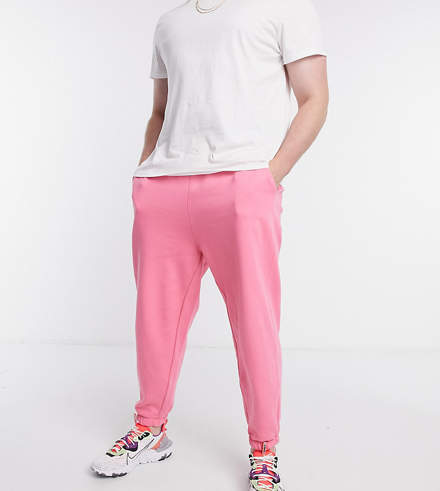 ASOS DESIGN Plus oversized sweatpants in bright pink matching set