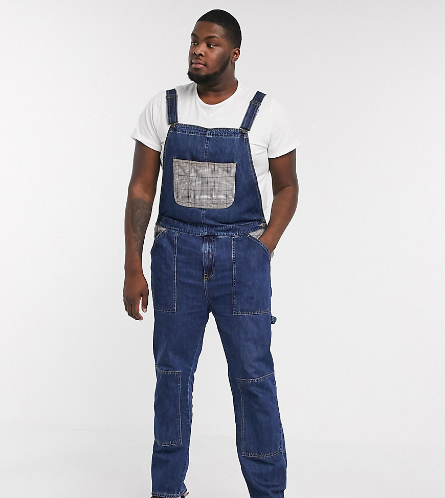 ASOS DESIGN Plus - Salopette di jeans da lavoro blu lavaggio scuro con tasche a quadri