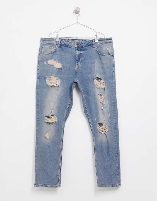 ASOS DESIGN Plus – Schmal geschnittene, blaue Jeans in heller Vintage-Waschung mit großen Rissen, 3 von 4