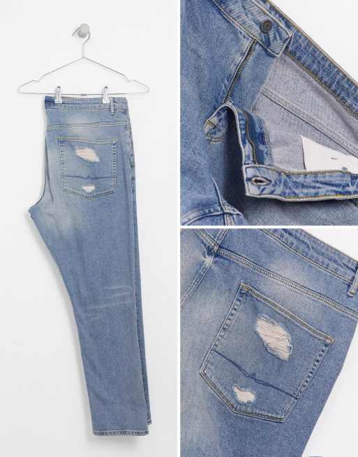 ASOS DESIGN Plus – Schmal geschnittene, blaue Jeans in heller Vintage-Waschung mit großen Rissen, 4 von 4