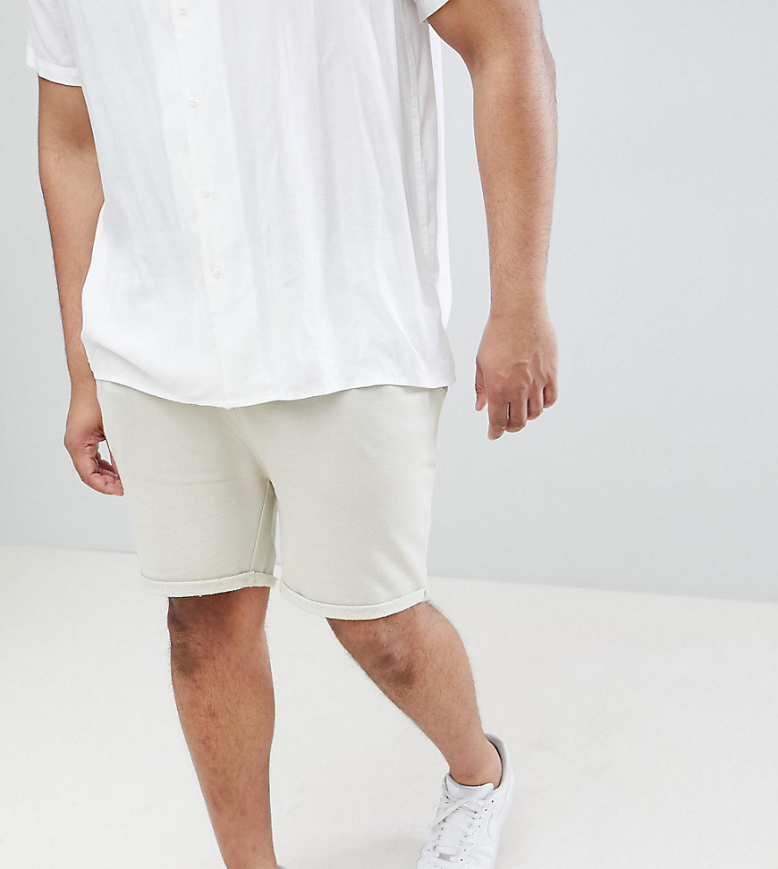 ASOS DESIGN Plus skinny shorts with turn up hem in beige
