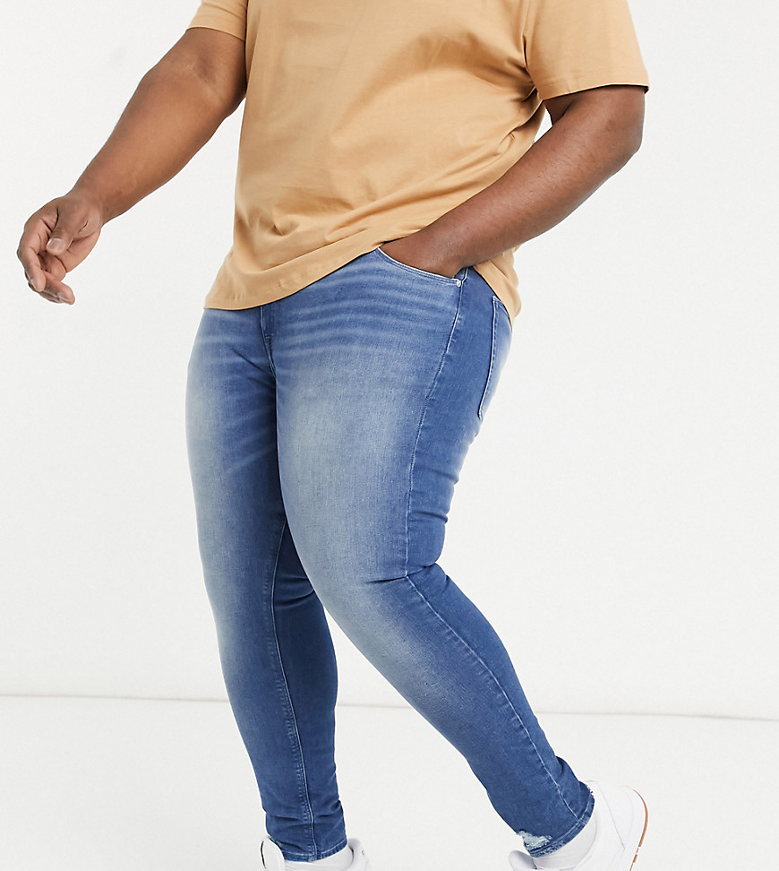 ASOS DESIGN Plus spray on jeans with power stretch in vintage dark wash blue with destroyed hem-Blues