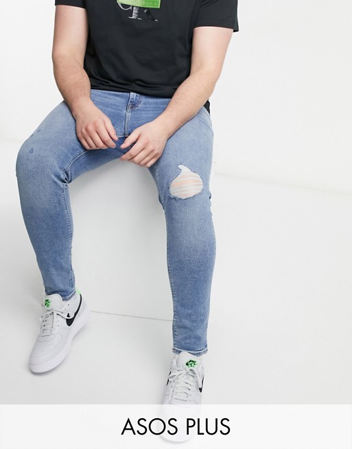 ASOS DESIGN Plus super skinny jeans in light wash blue with knee rip and abrasions