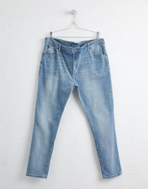 Levi's 512 slim taper jeans with knee rips in lightwash blue