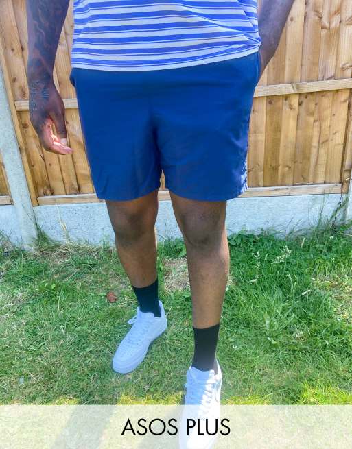 ASOS DESIGN Plus swim shorts in mid length in navy