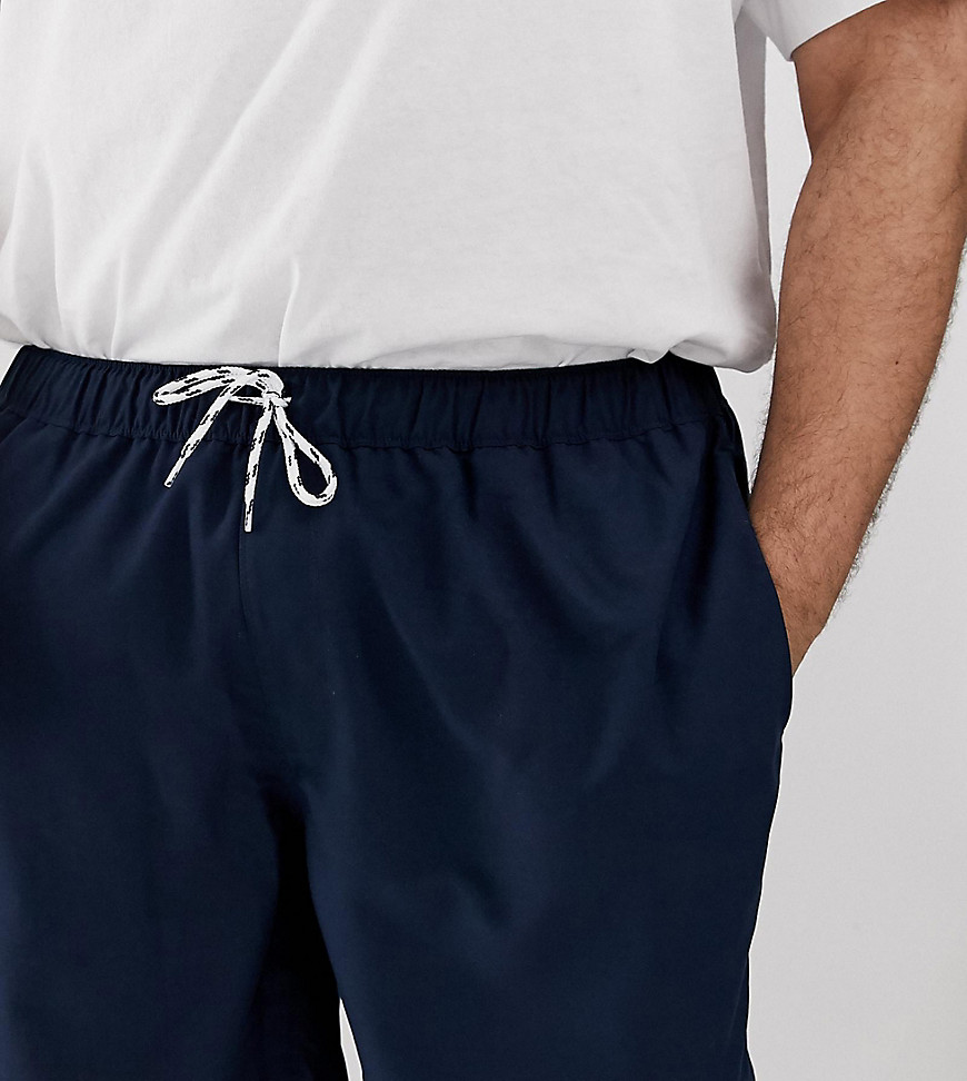 ASOS DESIGN Plus swim shorts in navy mid length