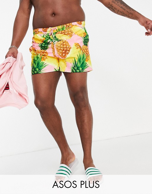 ASOS DESIGN Plus swim shorts with pineapple print in pink short length