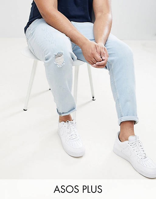 ASOS DESIGN Plus Tapered Jeans In Light Wash Blue With Abrasions