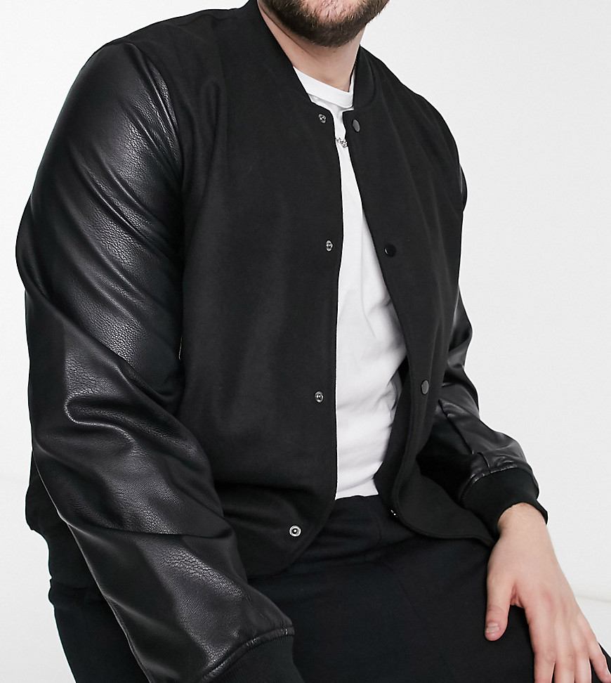 ASOS DESIGN Plus varsity jacket in black with faux-leather sleeves