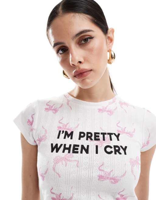 ASOS DESIGN pointelle baby tee with pretty slogan graphic in all over bow print, 2 of 4