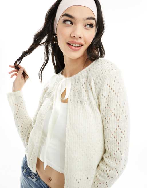 ASOS DESIGN pointelle knit slim fit cardigan with bow ribbon in ecru