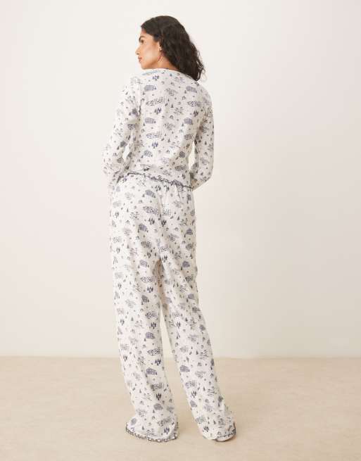 ASOS DESIGN pointelle pyjama trouser and long sleeve tee set in blue scenic print