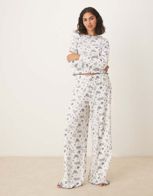 ASOS DESIGN pointelle pyjama trouser and long sleeve tee set in blue scenic print
