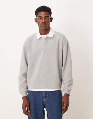 ASOS DESIGN - Polo décontracté en tissu côtelé avec étiquette tissée - Gris chiné