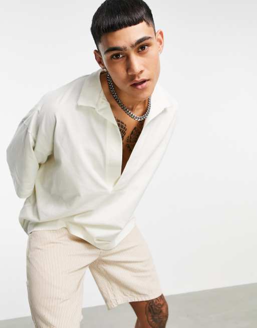 ASOS DESIGN - Polo oversize a mezze maniche con scollo a V profondo, colore bianco