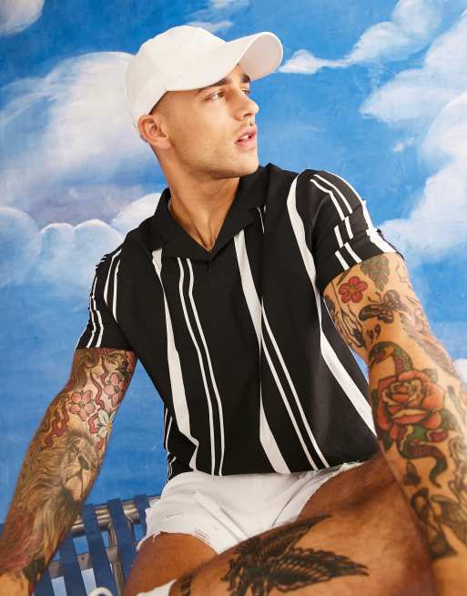 ASOS DESIGN - Polo oversize nera e bianca a righe con colletto con rever - BLACK
