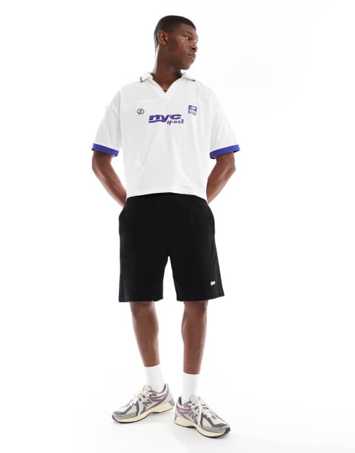 ASOS DESIGN boxy oversized polo shirt with cut and sew athletic graphics in white
