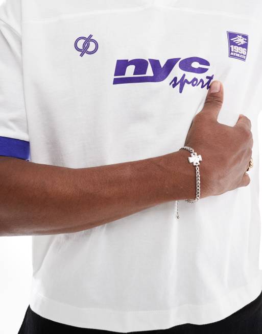 ASOS DESIGN boxy oversized polo shirt with cut and sew athletic graphics in white