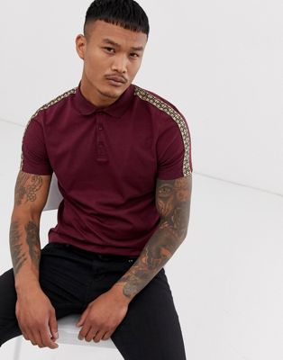 ASOS DESIGN polo shirt with geo taping in burgundy | ASOS