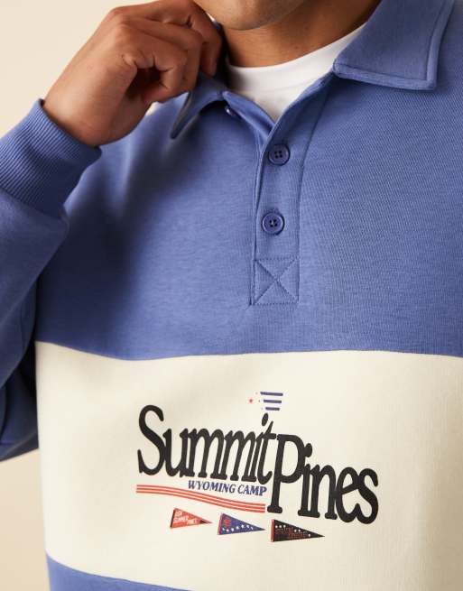 ASOS DESIGN polo sweatshirt with contrast panel and print in blue