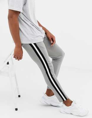 grey joggers with white stripe