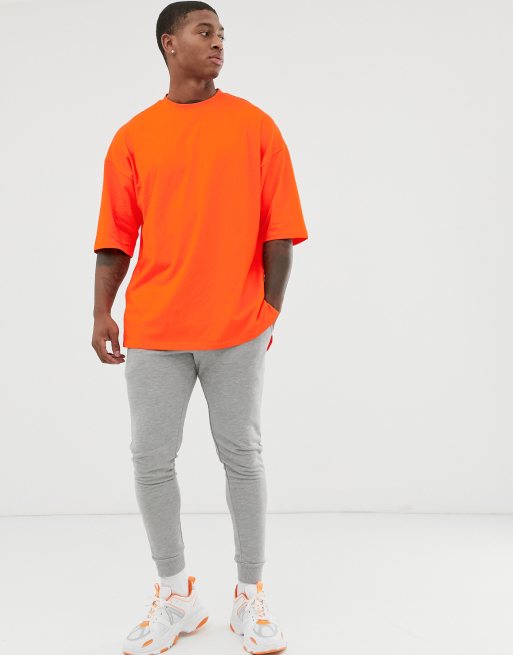 ASOS DESIGN Pomarańczowa koszulka OVERSIZE z rozcięciem po bokach