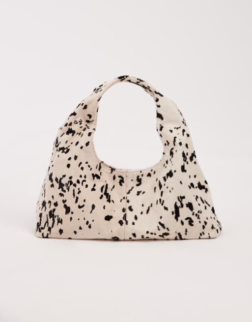 ASOS DESIGN pony hair mid size slouch shoulder bag in cow print