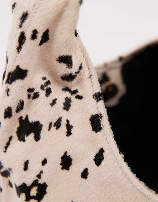 ASOS DESIGN pony hair mid size slouch shoulder bag in cow print