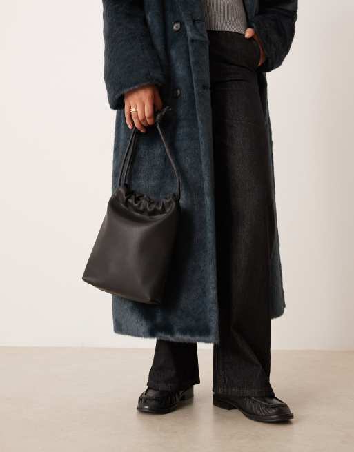 ASOS DESIGN pouch bag with tubular strap in black, 2 of 4
