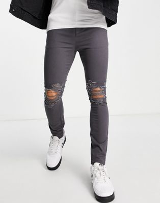 ASOS DESIGN spray on chinos with rips in charcoal