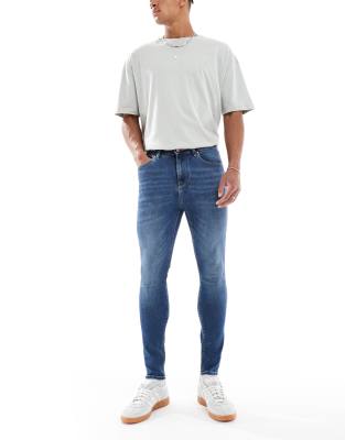 power stretch jeans in dark wash blue