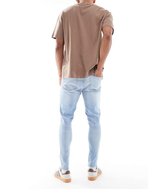 ASOS DESIGN power stretch jeans in light wash blue